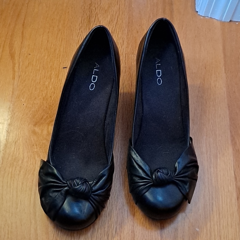 Kitten heels. Detailed toe bow. Wide width